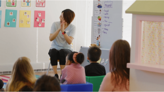 Occupational Therapist Engaging With The Children In Circle Time in LDS Early RISErs Program.