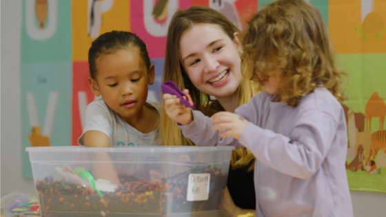 Lead Instructor & Early RISErs Program Manager, Marlo leading two children in Sensory Play