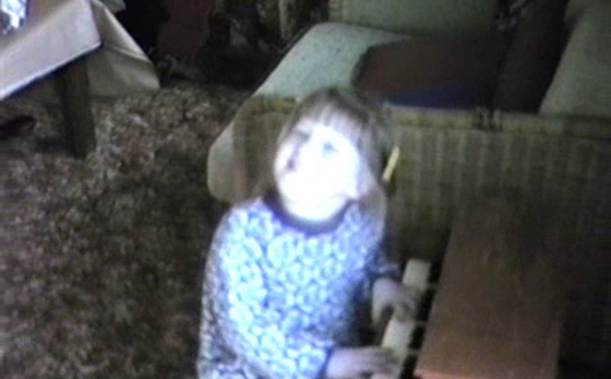 Two-year-old Marisa Levenson sitting at a piano and beginning her musical journey
